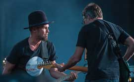 Pearl Jam bassist Jeff Ament and rhythm guitarist Stone Gossard on stage at Washington-Grizzly Stadium
